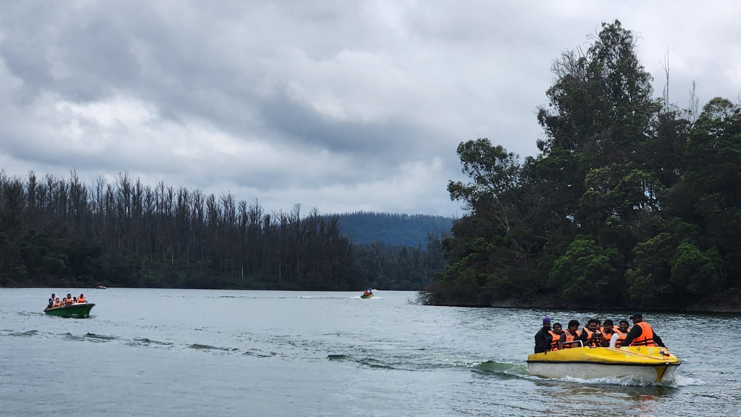 Tourists enjoying boat ride at Pykara Lake during Ooty one day trip - Travora Voyagers